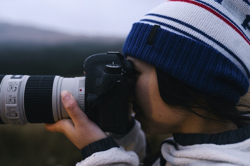 photographer with telephoto lens