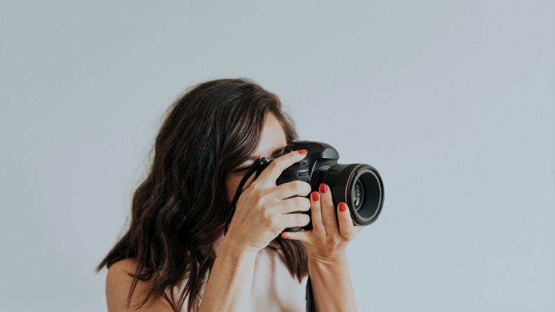 female photographer with camera